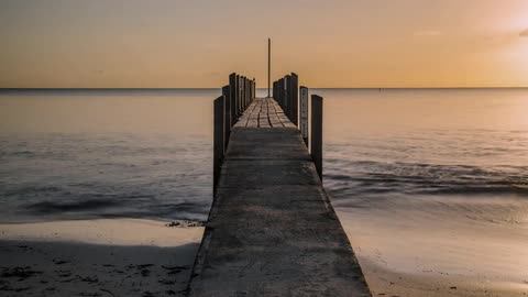 time lapse of a pier at sunrise