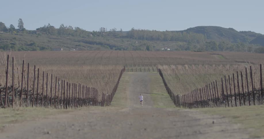 Man running down a country path