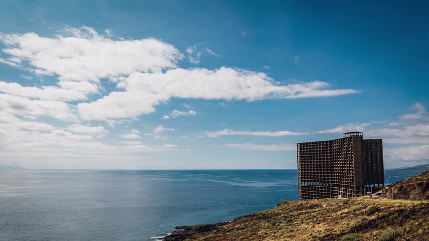 A large building on the ocean