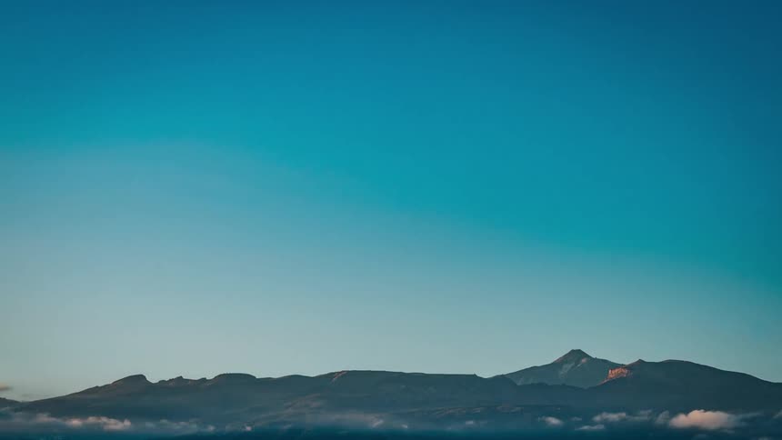 Fog near a long stretch of mountains