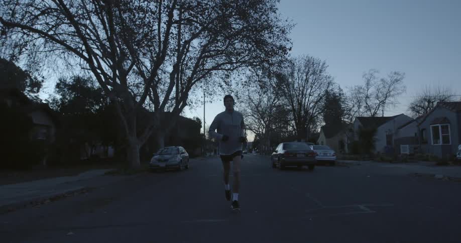 A person is jogging on the street