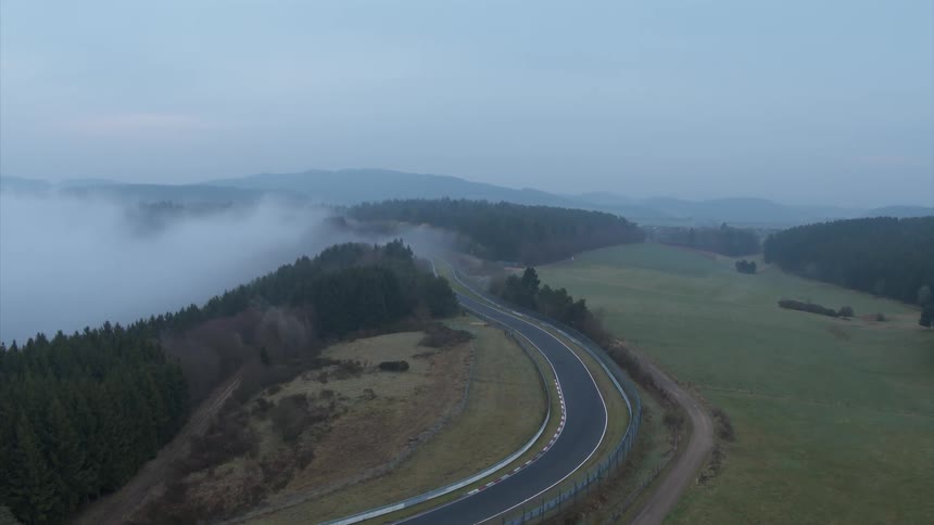 A drone films a curvy road