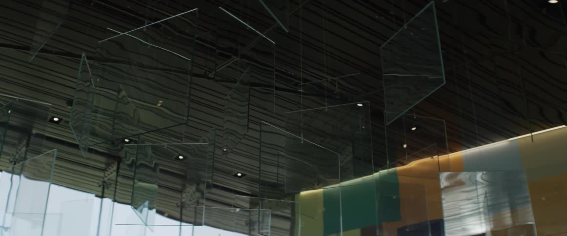 Squares of glass hanging from the ceiling