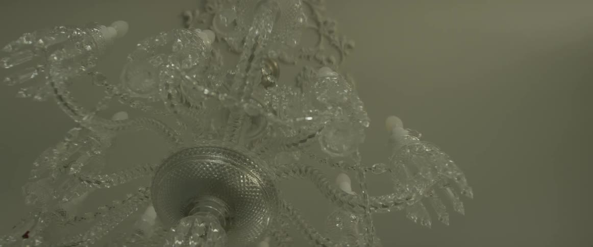 A glass chandelier hangs from the ceiling