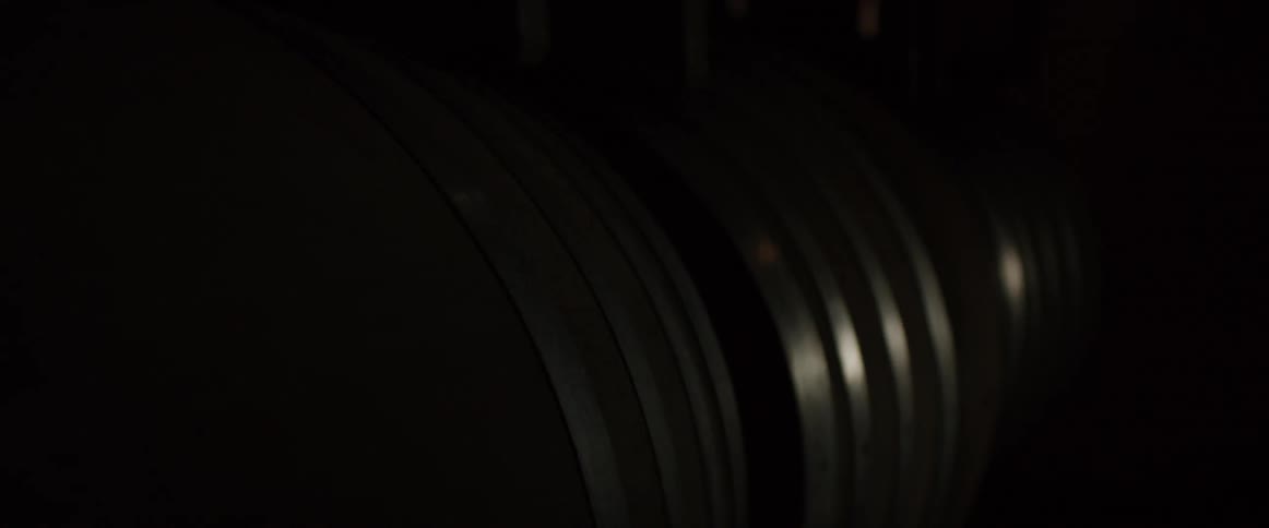 Barrels with silver trim sit next to each other