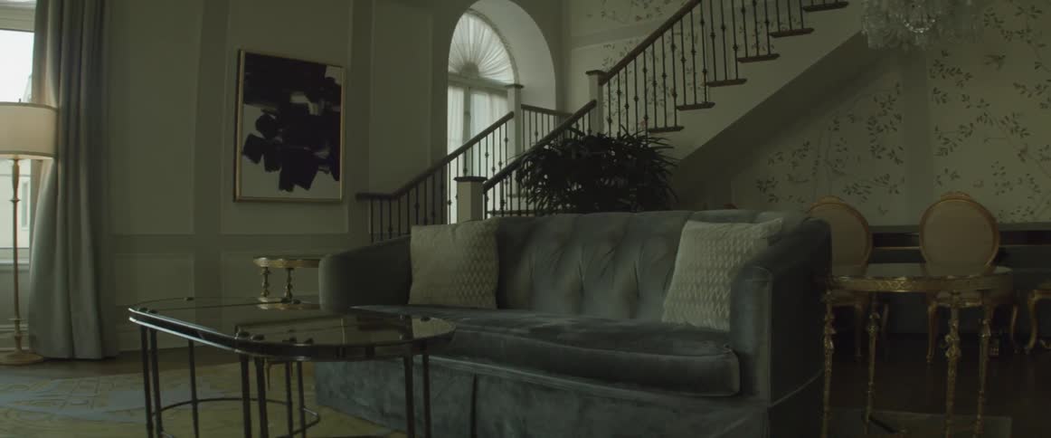 A living room sits empty during the day