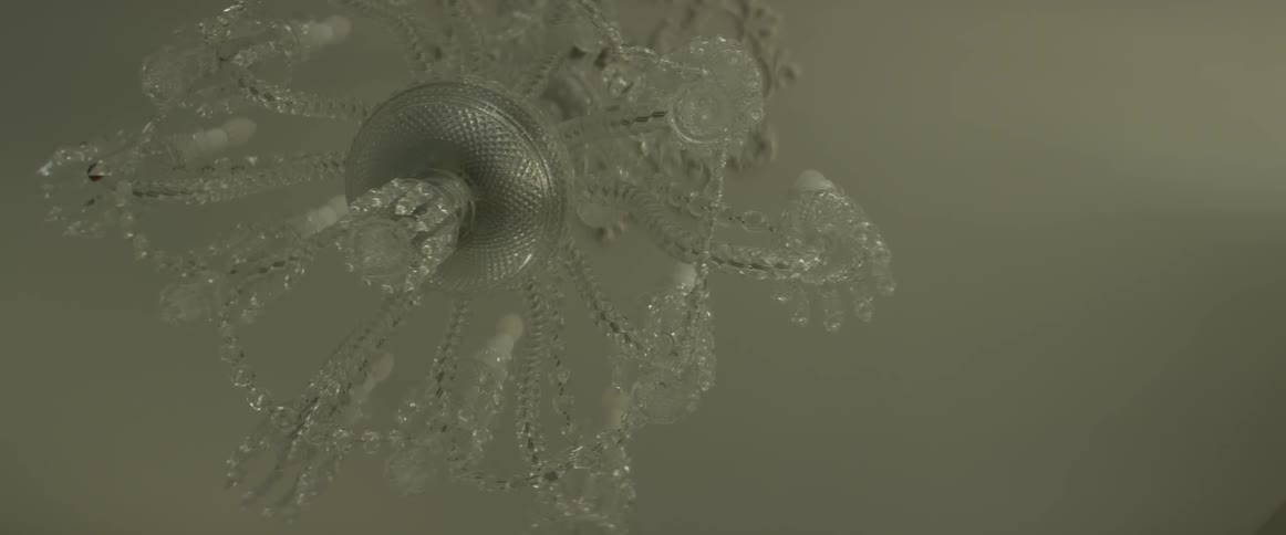 A chandelier is being filmed from underneath