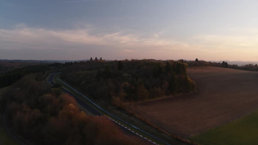 Highway surrounded by fields and trees