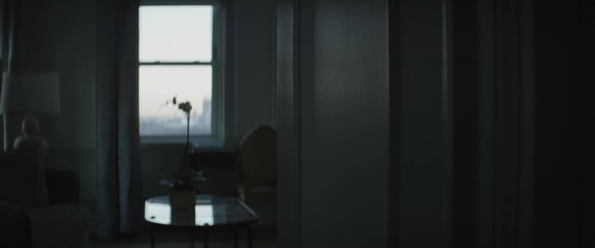 An empty desk sits in an empty house