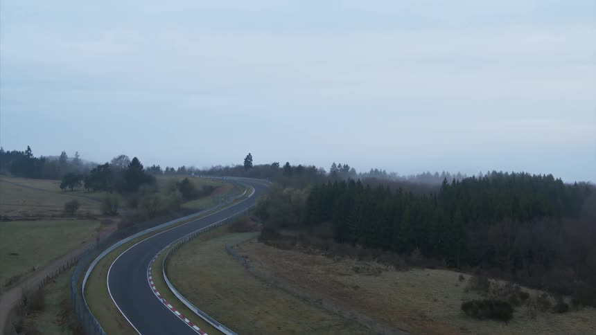 A twisting road near a forest