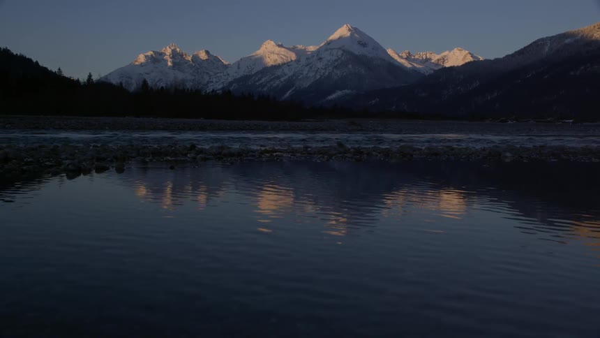 Water flows between mountains