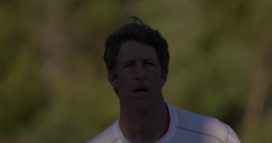 A man goes jogging outdoors