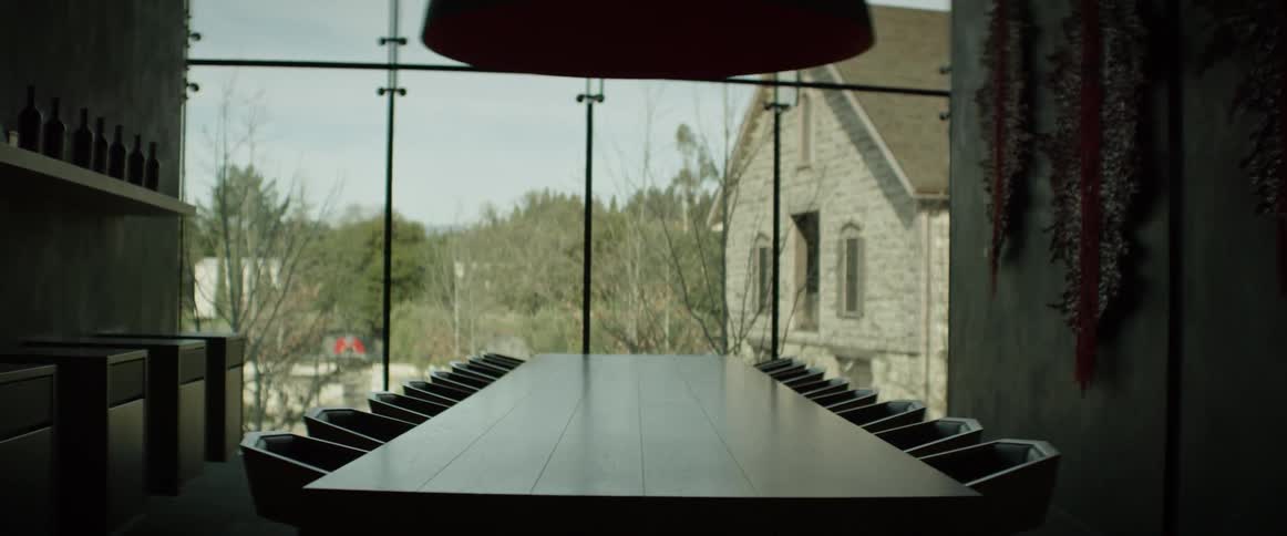 A table lined with chairs