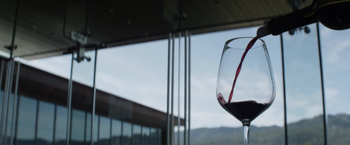 Wine is poured into a wine glass