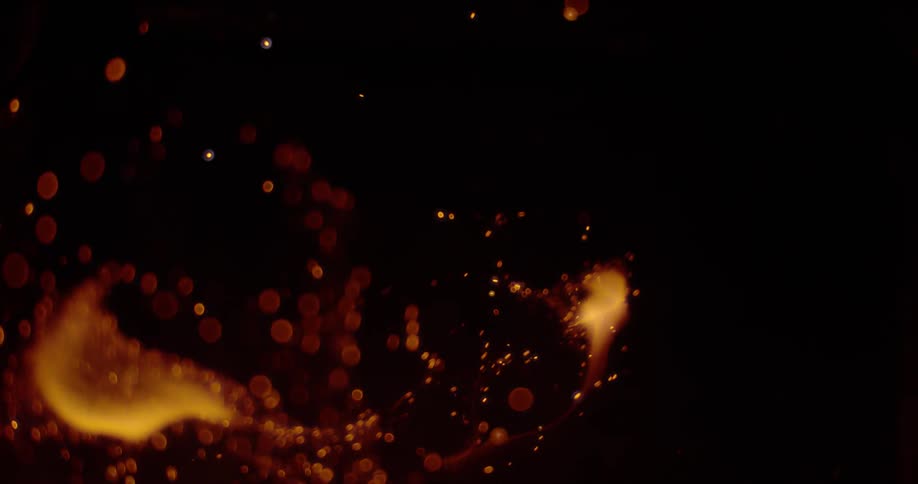 Flames are casting sparks into the darkness