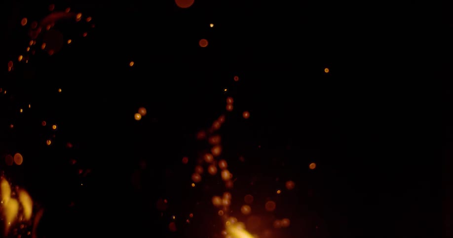 Flames are casting sparks into the darkness