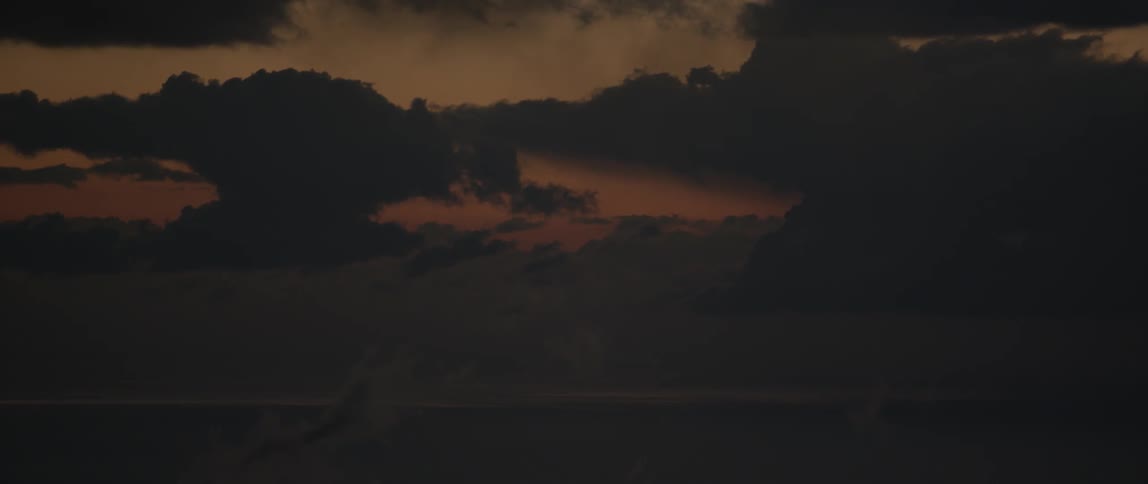 Clouds hang above at dusk