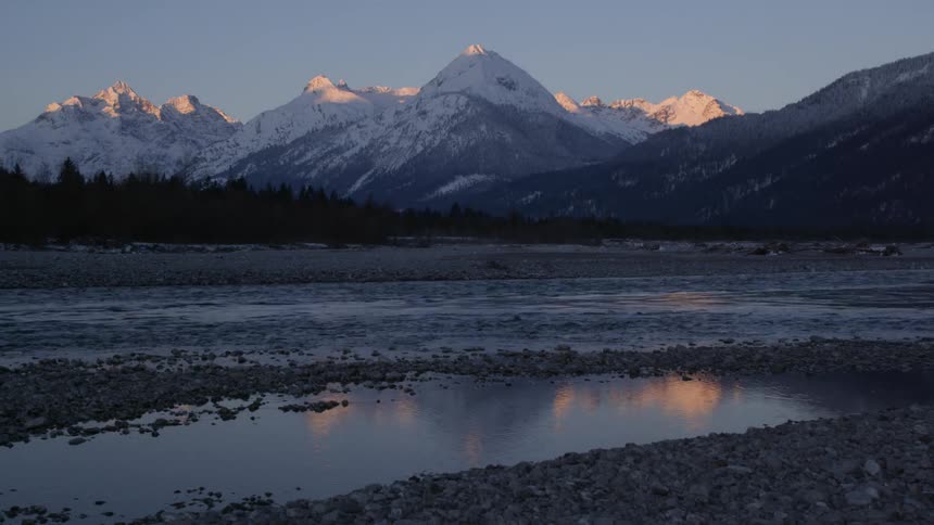 Water flows between mountains