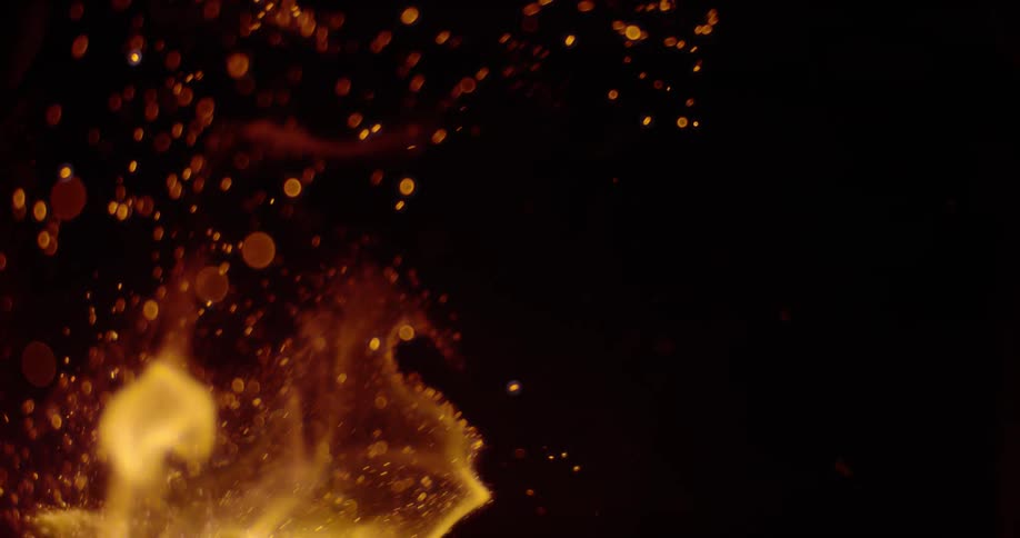 Flames sparking in a dark room