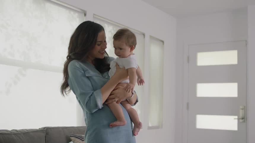 A woman bounces a baby