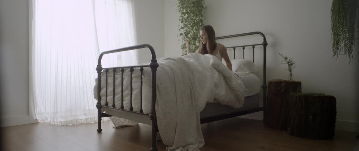 A woman sitting in bed