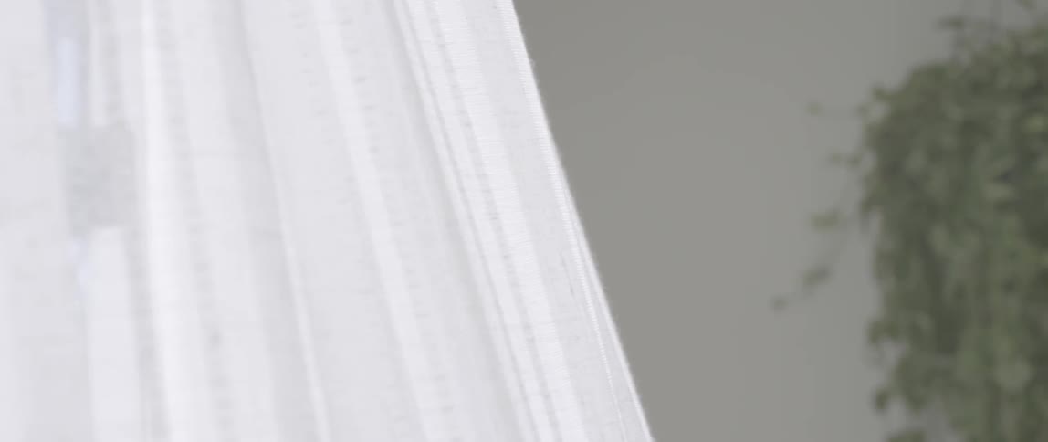 White curtains blow in the wind
