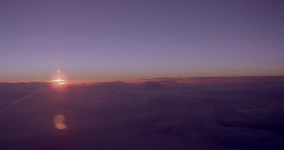 A panoramic view of cloud covered sky at sunset