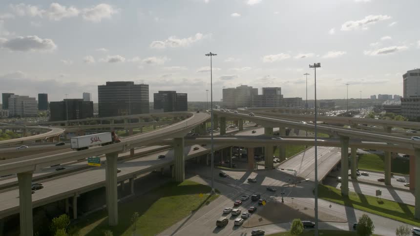A expressway system is being filmed with a drone