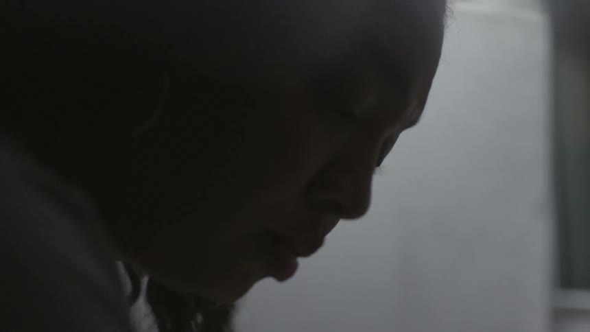 A woman stares down