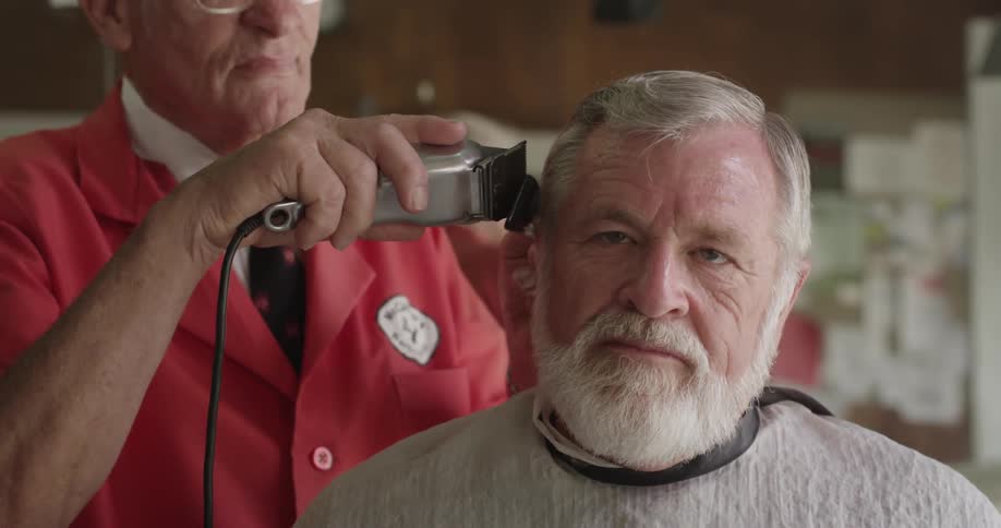 A man is getting a haircut