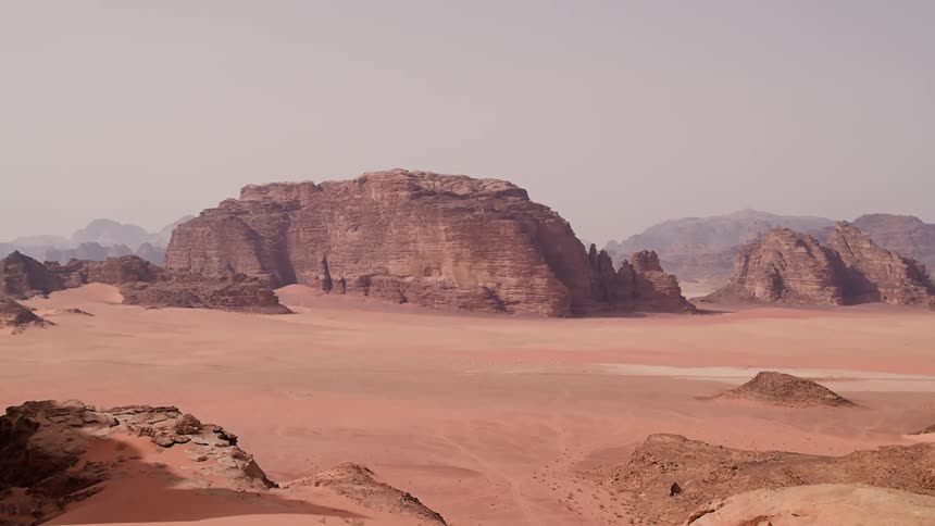 Huge rock formations rising from a desolate area