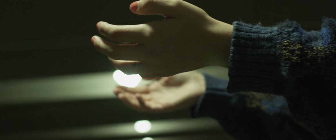 A woman reaches for a retreating person
