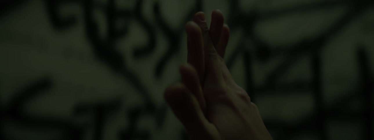 A person rubs their hands together