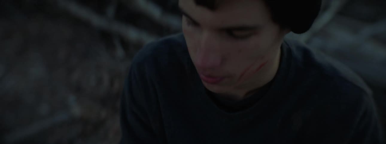 A man has blood on his hands, and he takes a smoke from a cigarette
