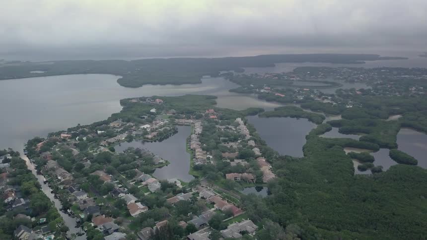 A large suburb is being filmed from a drone