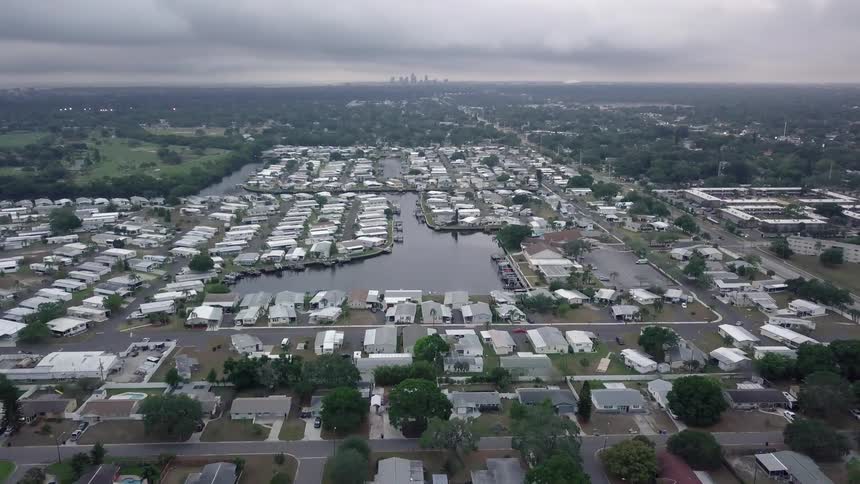 Many homes fill this town around a small pool of water