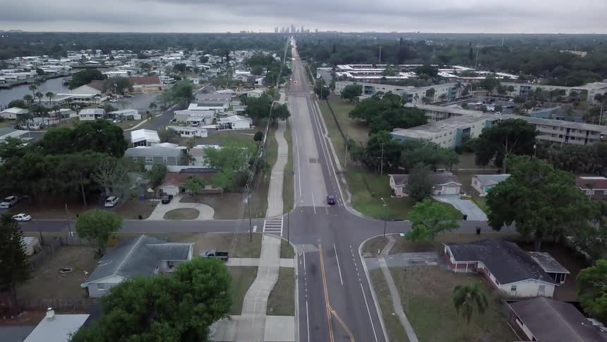 A drone is filming a city from the air
