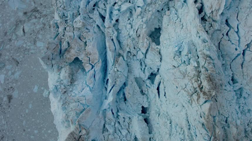 Snow covered mountain with crevices