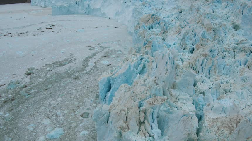 A glacier is being flown over by a drone