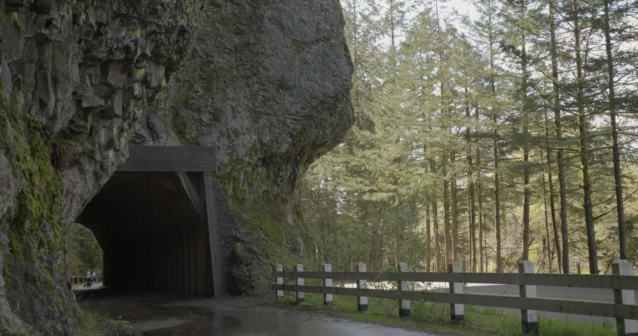 A tunnel runs through a rock structure