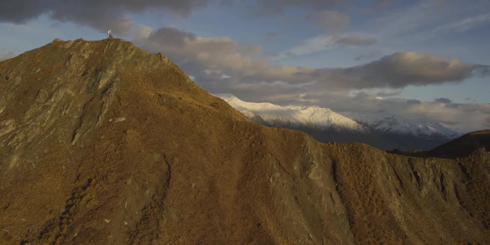 Clouds float over a mountain range