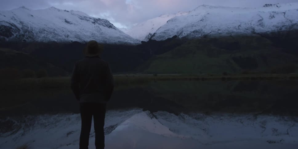 A man is watching the sunset