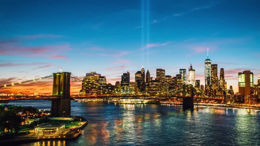 A waterside city at sunset