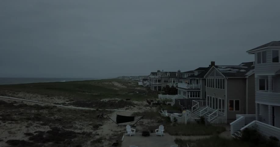 Houses next to the water on a cloudy day