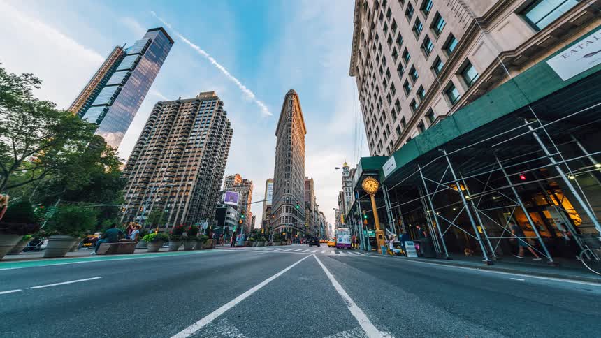 Time lapse of buses and cars driving down a city street