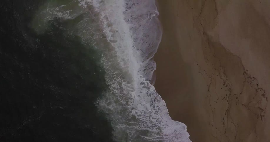 Waves crash onto the shore