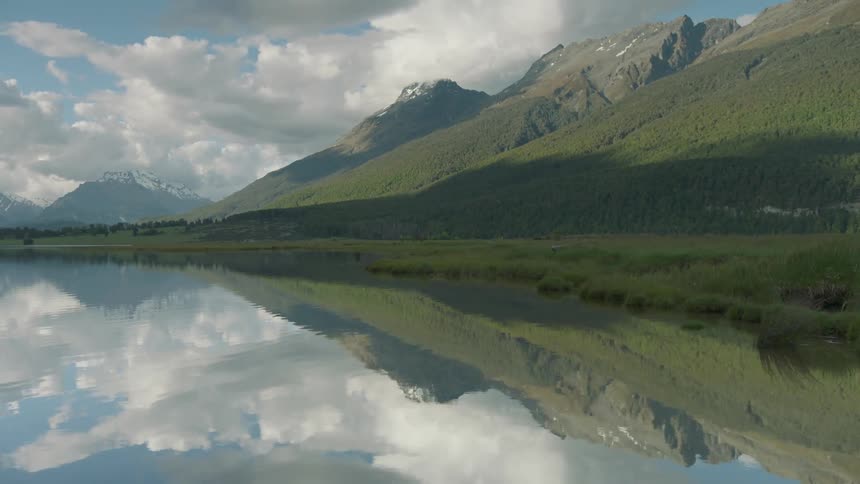 Water gently flows towards the shore