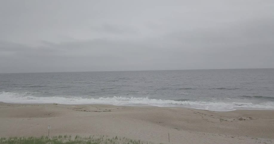 Waves crash onto the shoreline