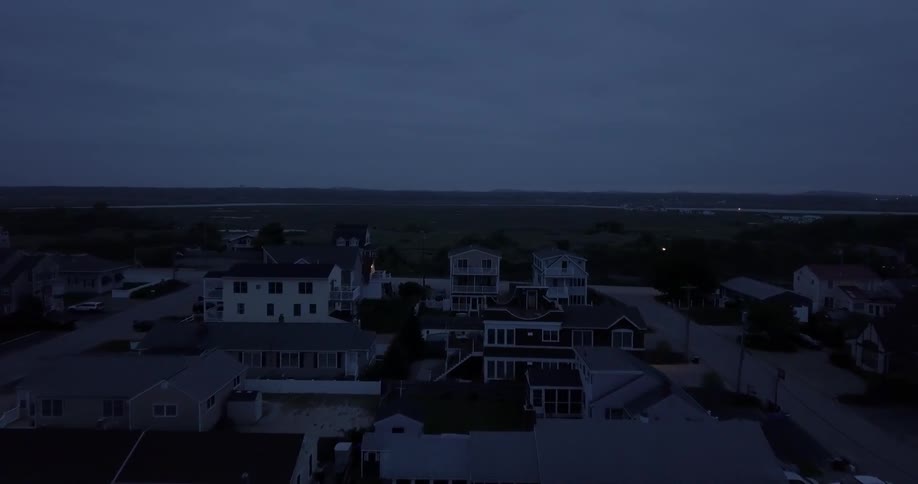 Overhead view of houses on a cloudy evening