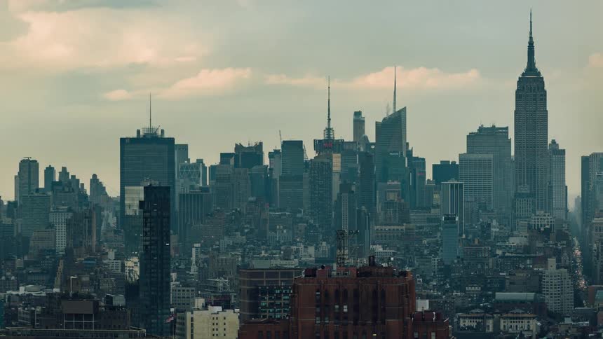 Tall city buildings tower into the sky